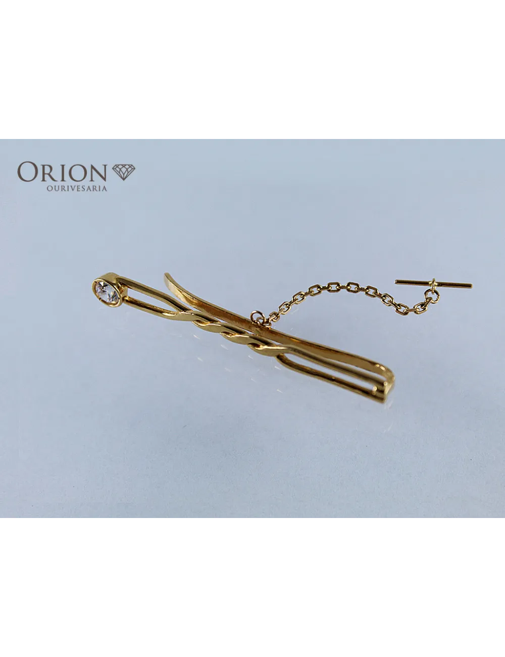 Alfinete em ouro usado